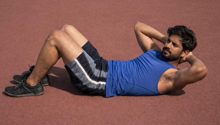 Man doing side crunches exercise