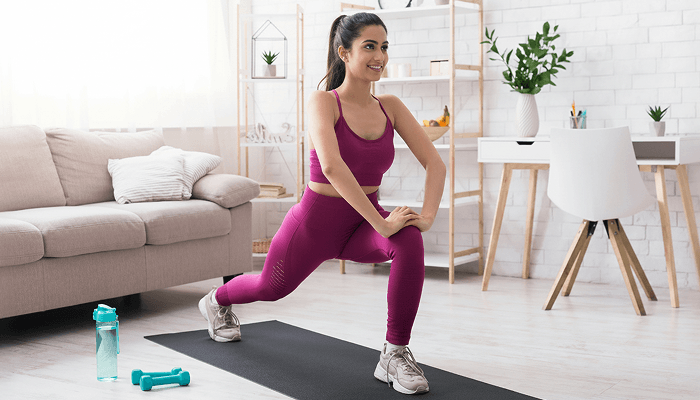 A woman doing exercise using Fitcoach