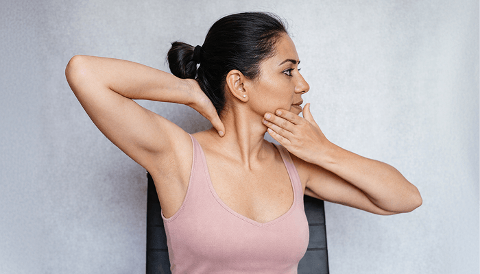 A girl doing neck exercise for a perfect jawline