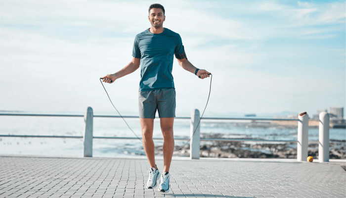 athlete skipping during a HIIT workout outdoors