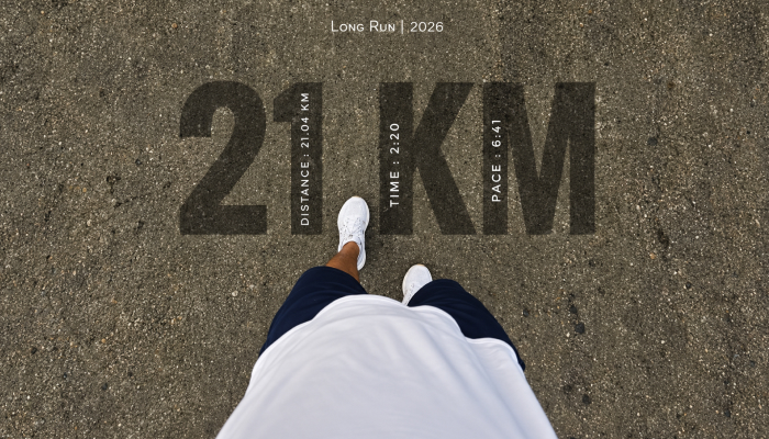 a fitness aesthetic graphic showing half marathon distance and an athlete in sports shoes ready to take on the long distance running with the right strategies and prepration.