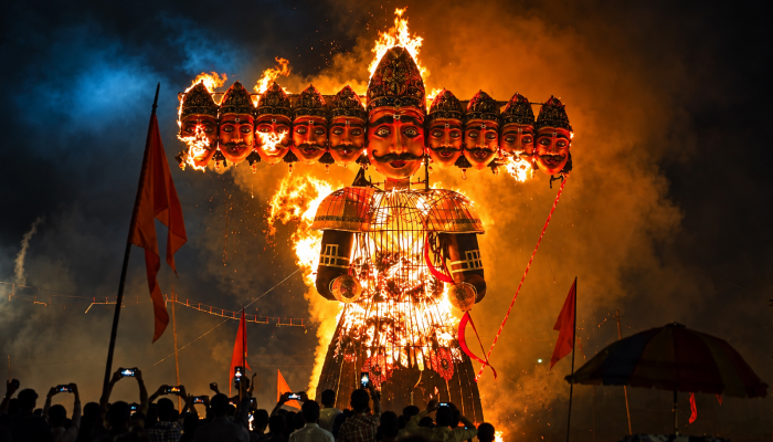 an image showing the ravana dahan scene with burning effigy of ravanana for dusshera 2026 celebration signifying the victory of good over injustice.